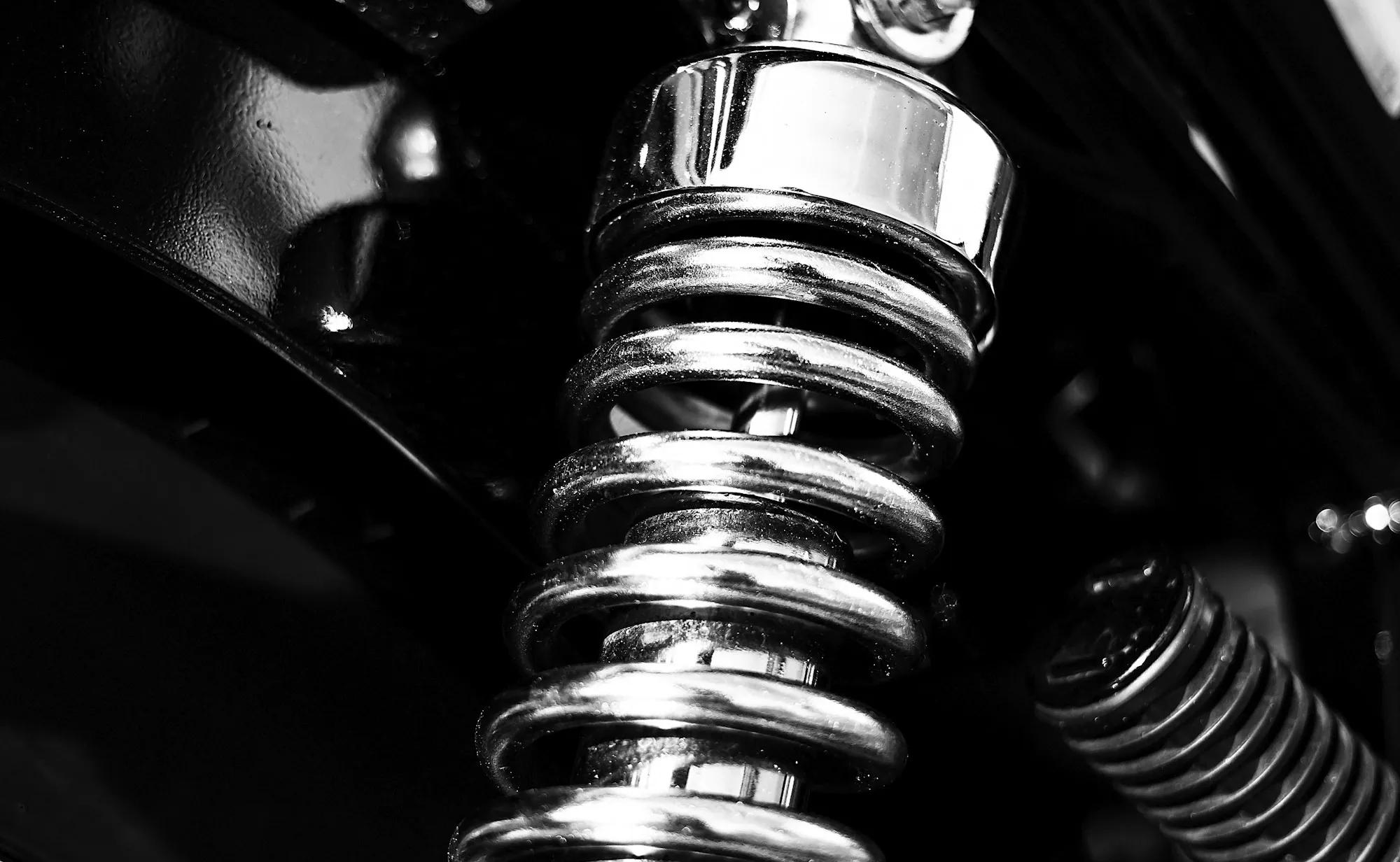 Front suspension, hub and control arm assembly on a lifted car